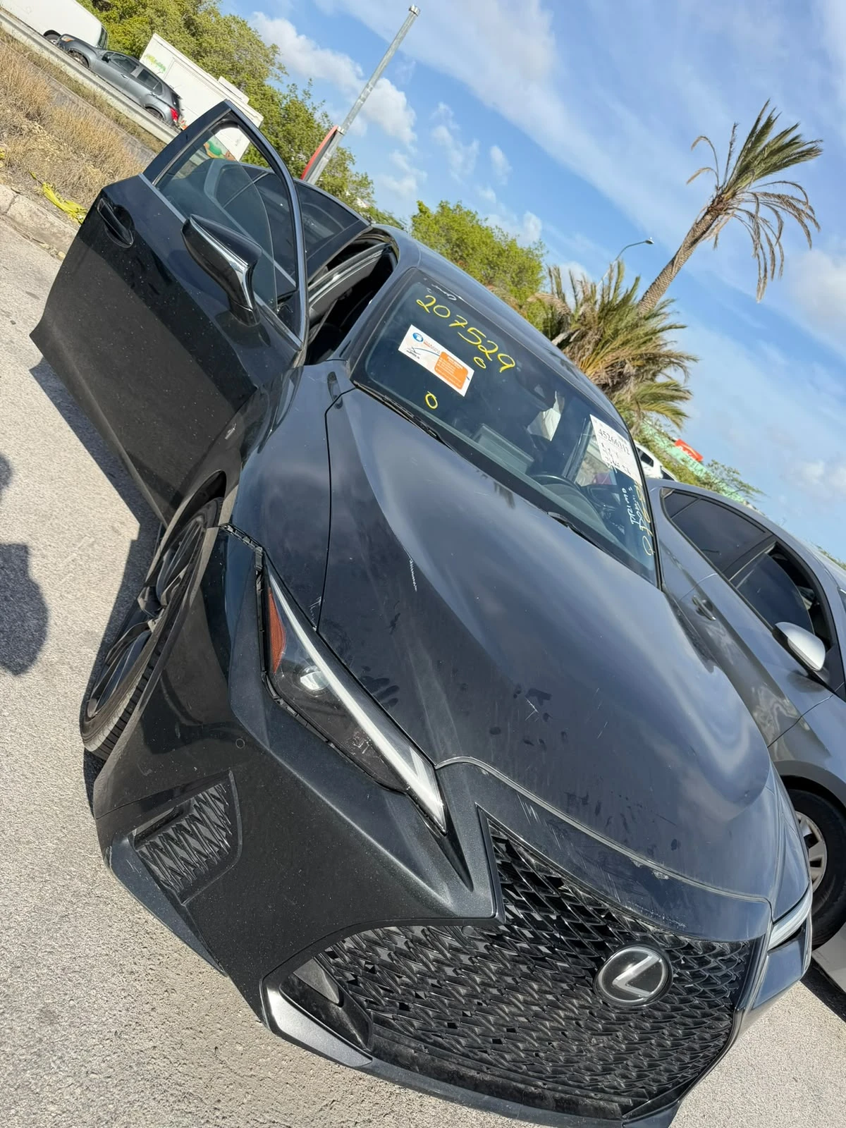 Black Lexus IS with the door open, delivered in Curaçao